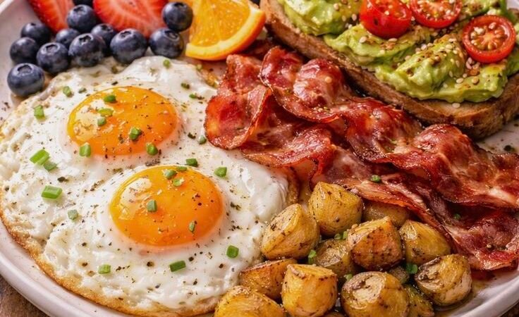 Healthy Breakfast Plate with Avocado Toast, Eggs, Bacon & Roasted Potatoes
