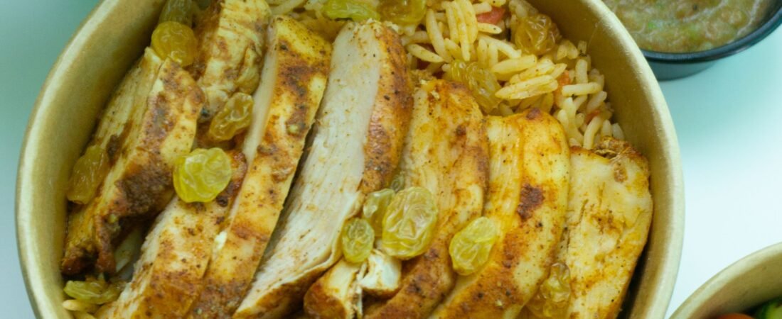 Spiced Chicken Breast Rice Bowl with Golden Raisins and Roasted Vegetables