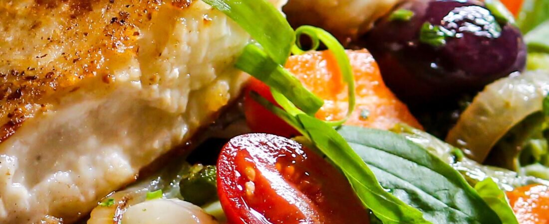 Pan-Seared Chicken Breast with Roasted Red Onion, Cherry Tomatoes and Olives
