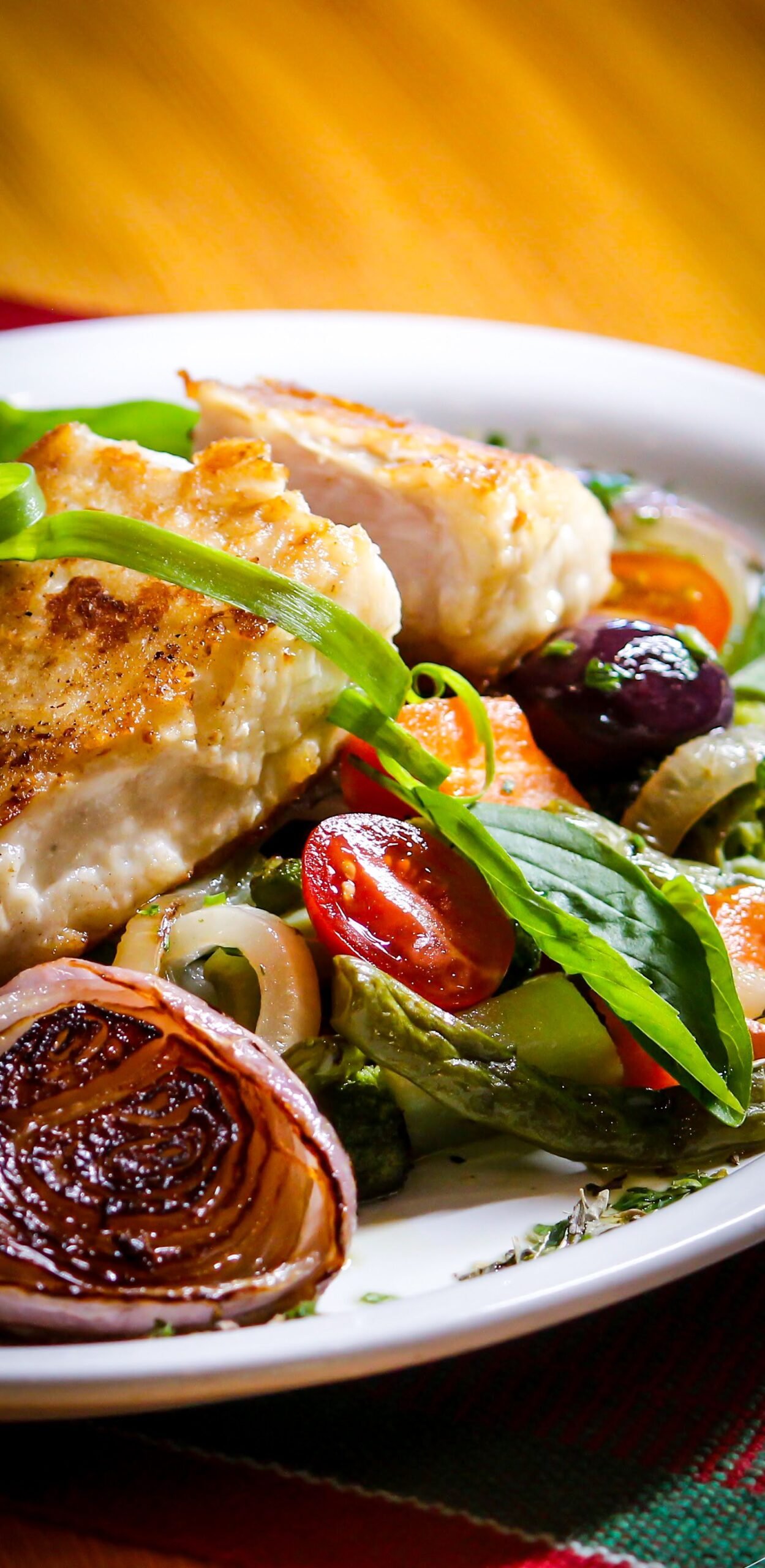 Pan-Seared Chicken Breast with Roasted Red Onion, Cherry Tomatoes and Olives