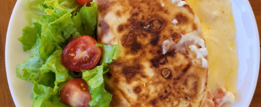 Ham and Cheese Stuffed Flatbread with Melted Cheese and Fresh Side Salad