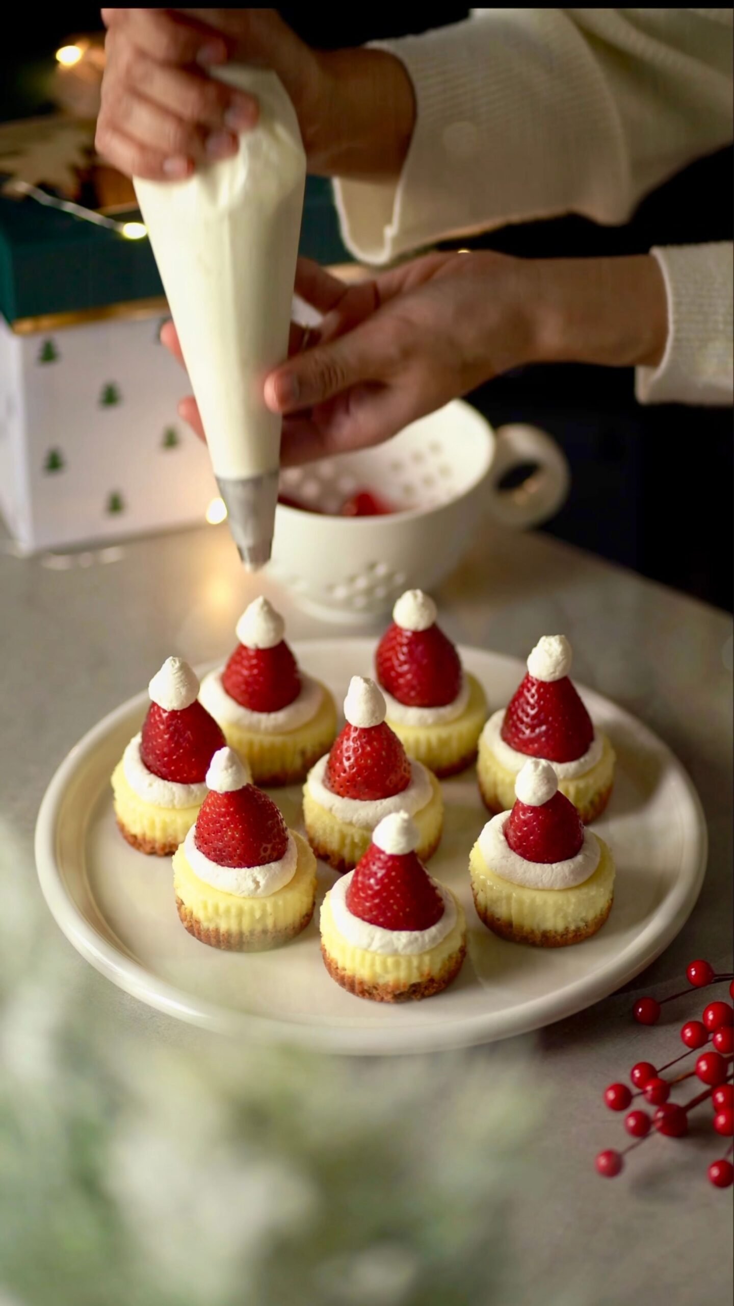 Santa Hat Mini Cheesecakes with Strawberries and Whipped Cream