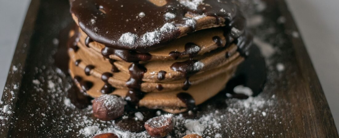 Chocolate Pancakes with Dark Chocolate Sauce, Hazelnuts and Almonds