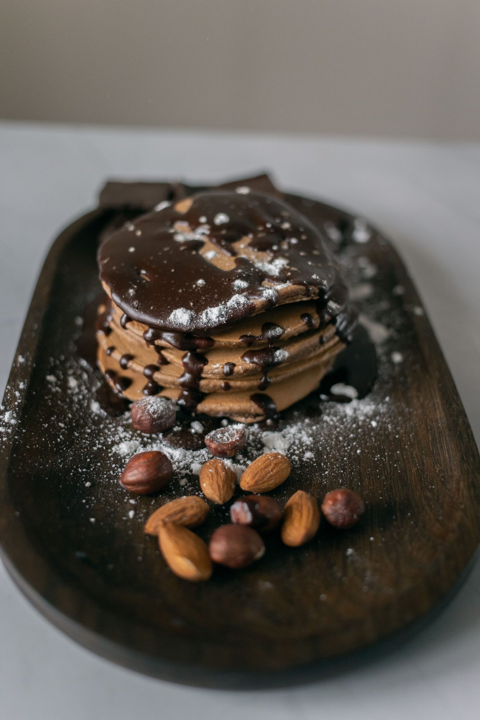 Chocolate Pancakes with Dark Chocolate Sauce, Hazelnuts and Almonds