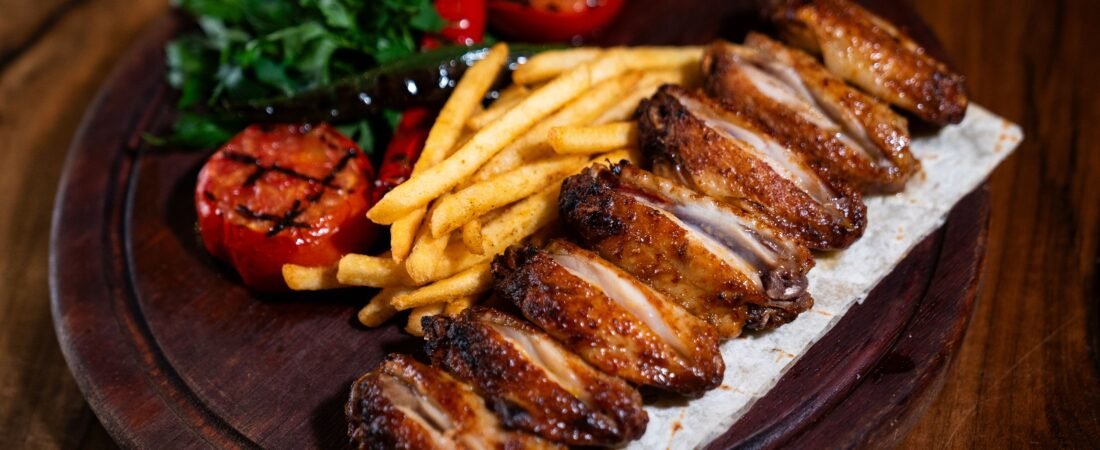 Turkish-Style Grilled Chicken Wings with Fries, Charred Tomatoes and Parsley