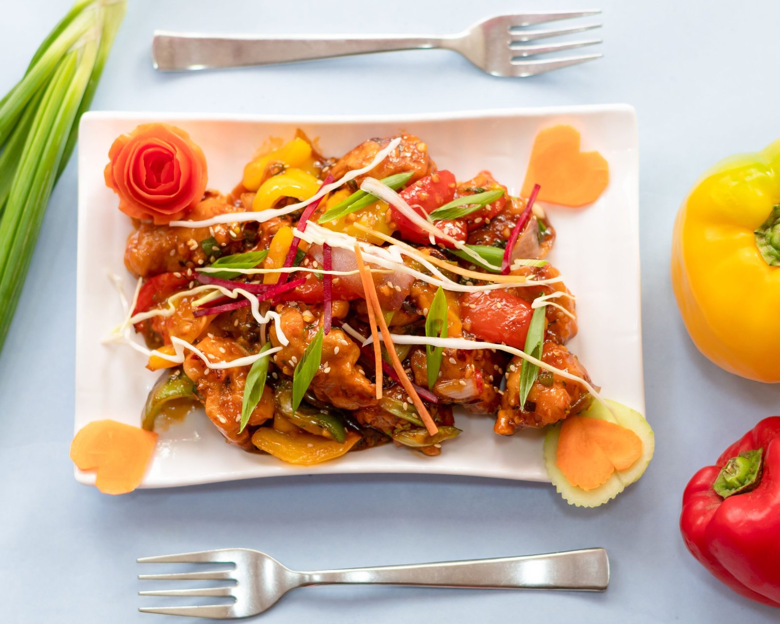 Sweet and Spicy Honey Chilli Chicken with Colorful Bell Peppers and Sesame